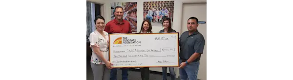 Large check donated to Child Advocates San Diego